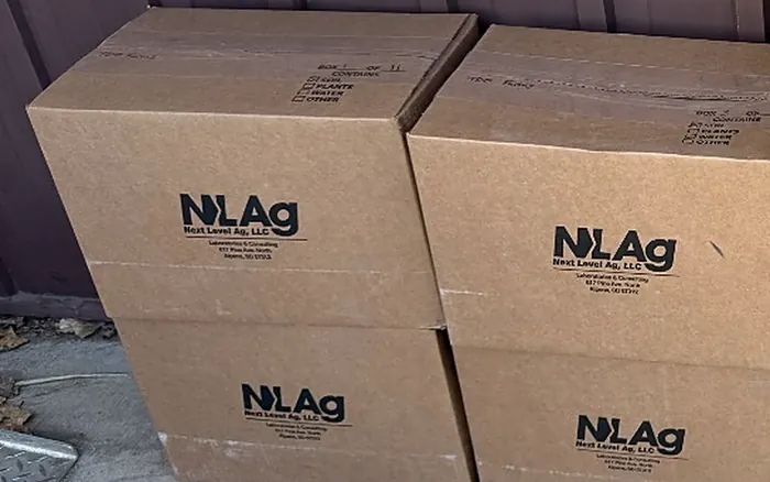 Stacked Next Level Ag soil sample shipping boxes